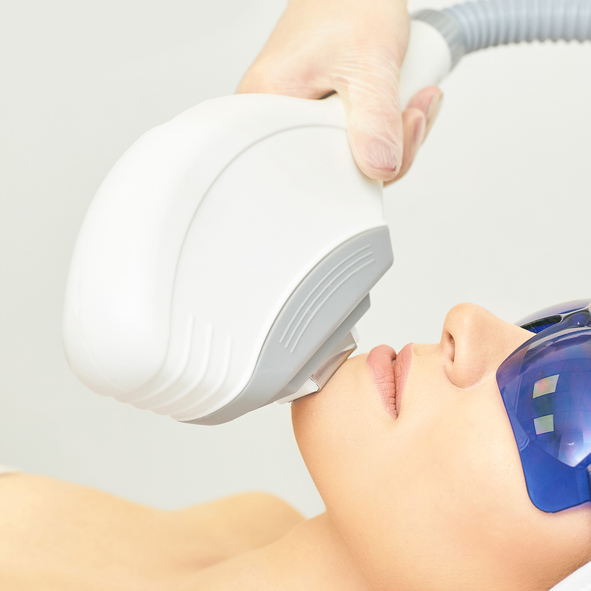 Anti acne removal procedure. Cosmetology device. Woman facial tightening clinic. Beautiful girl and doctor hand